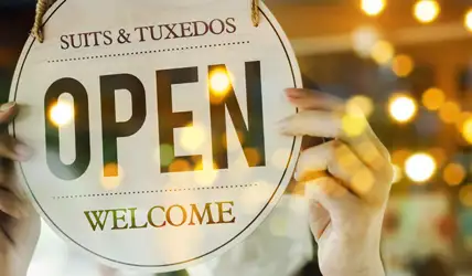 Store sign being flipped open after becoming a new JFW retailer